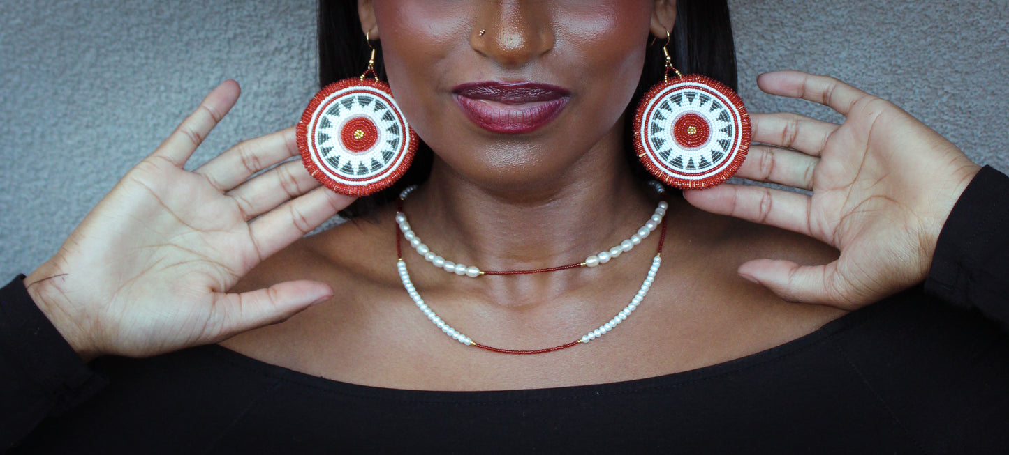 Too wūtch-un (sun) earring