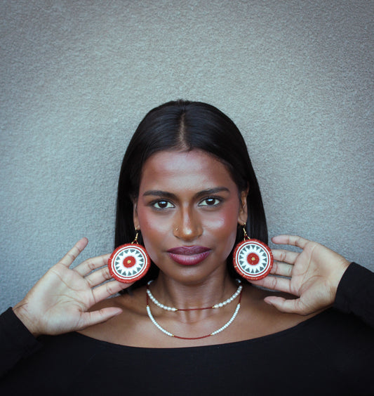 Too wūtch-un (sun) earring