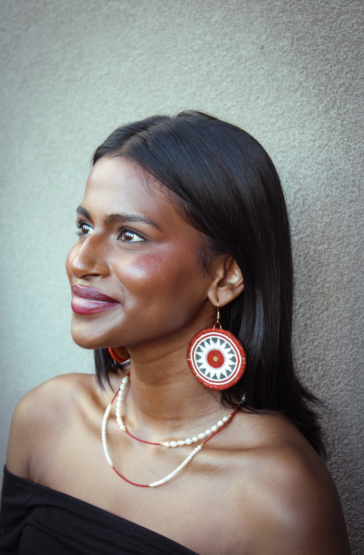 Too wūtch-un (sun) earring
